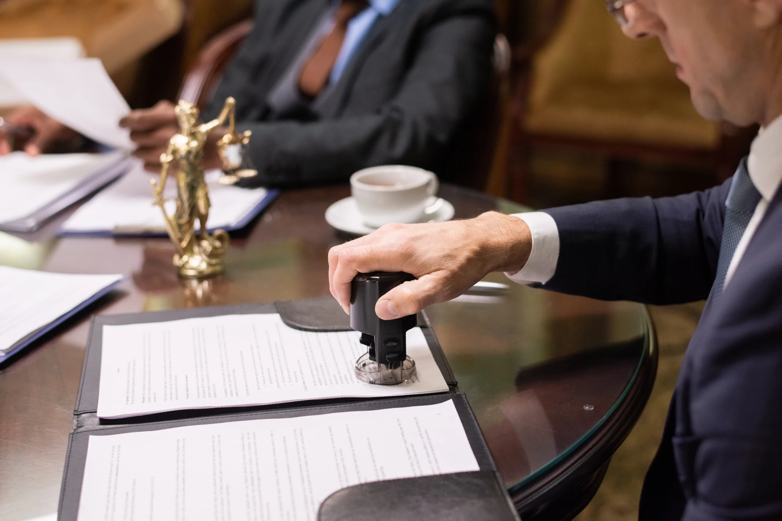 Business professional reviewing legal documents related to PERM audit compliance and immigration requirements