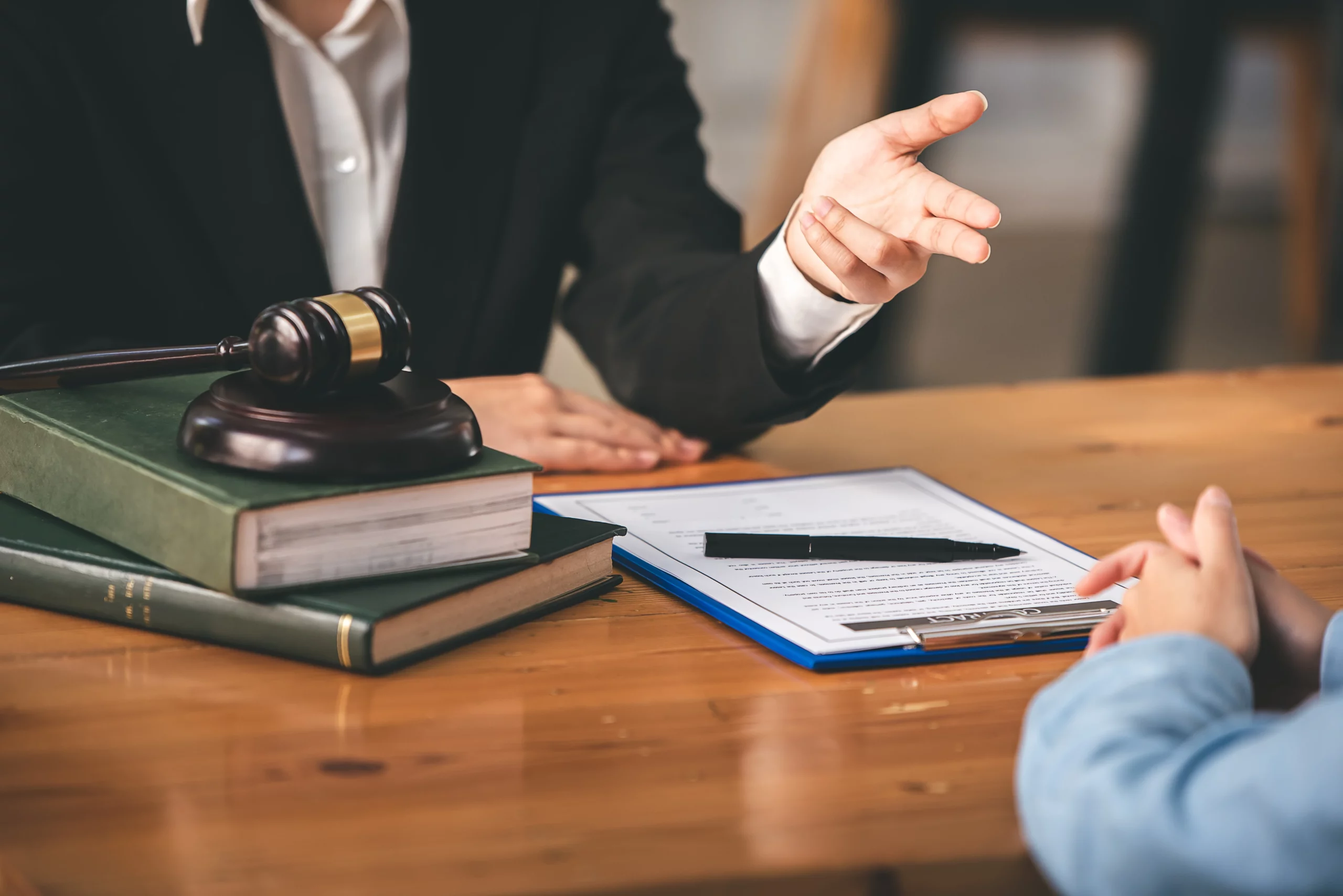 Immigration lawyer consulting with client about travel while adjustment of status application is pending