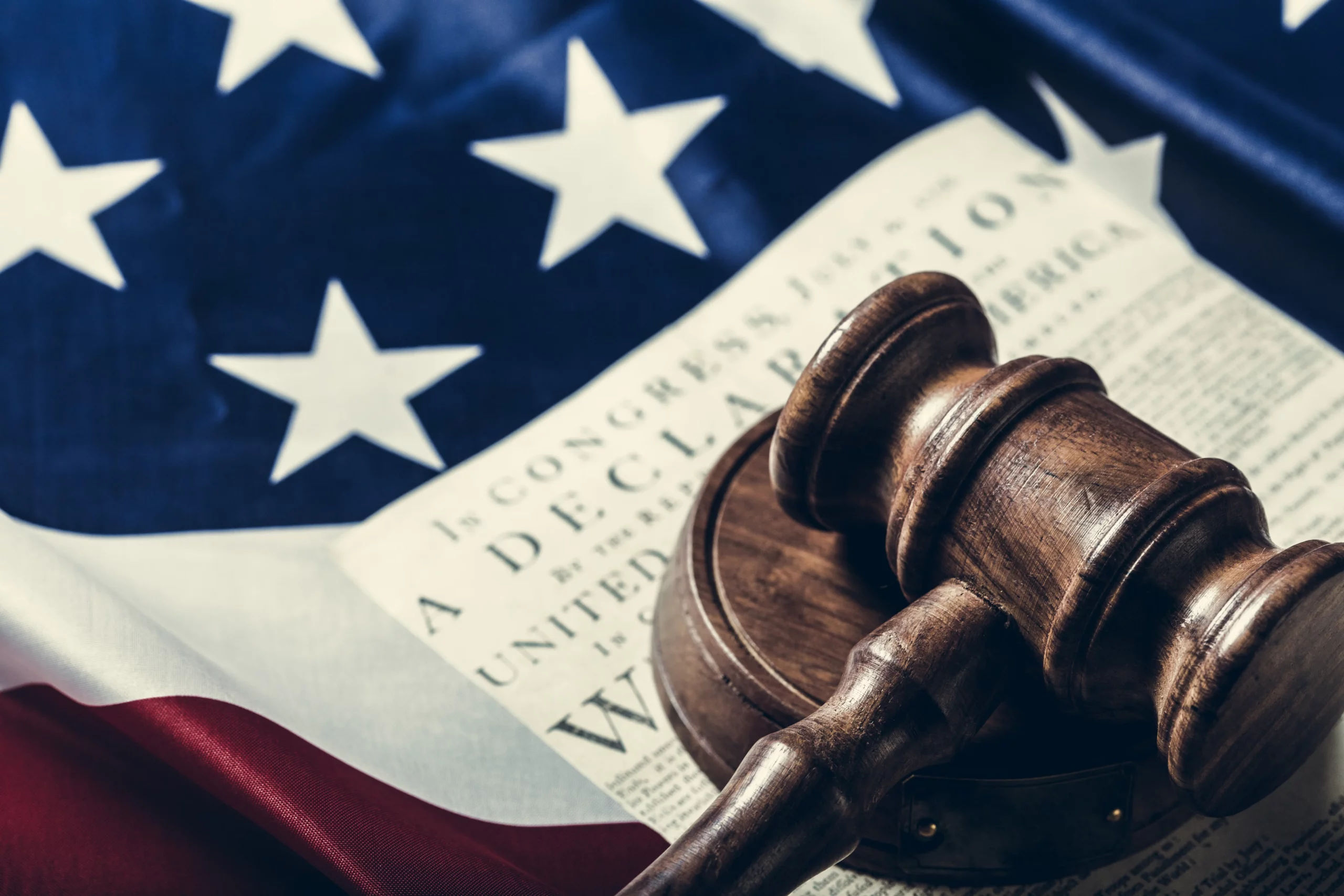 American flag and judge’s gavel representing federal immigration litigation and justice in the United States